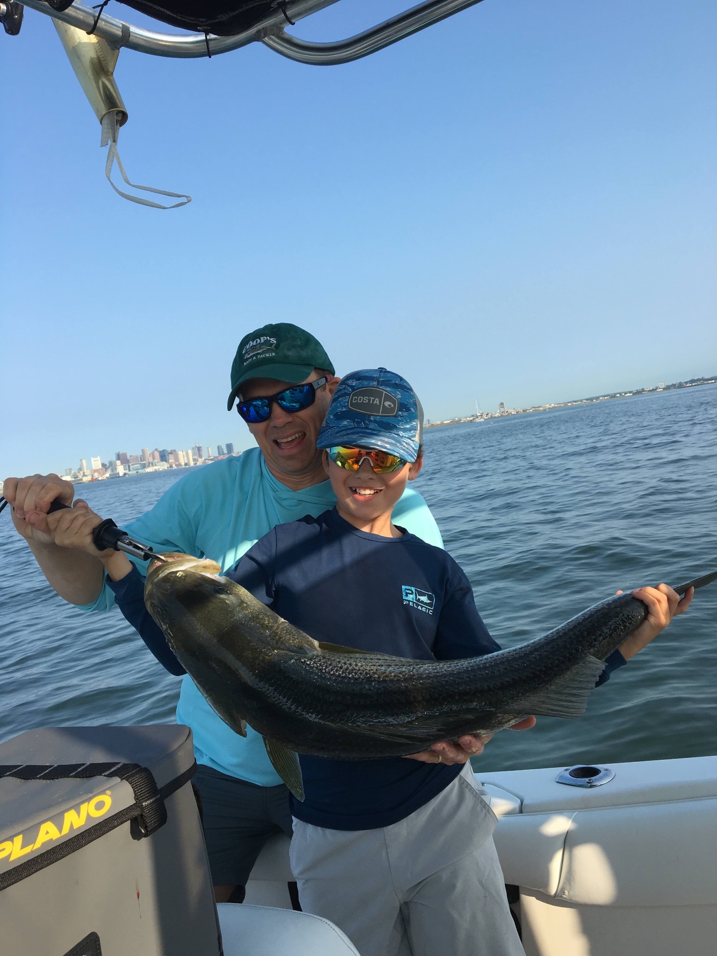 Rob and his son with a Boston Harbor striper
